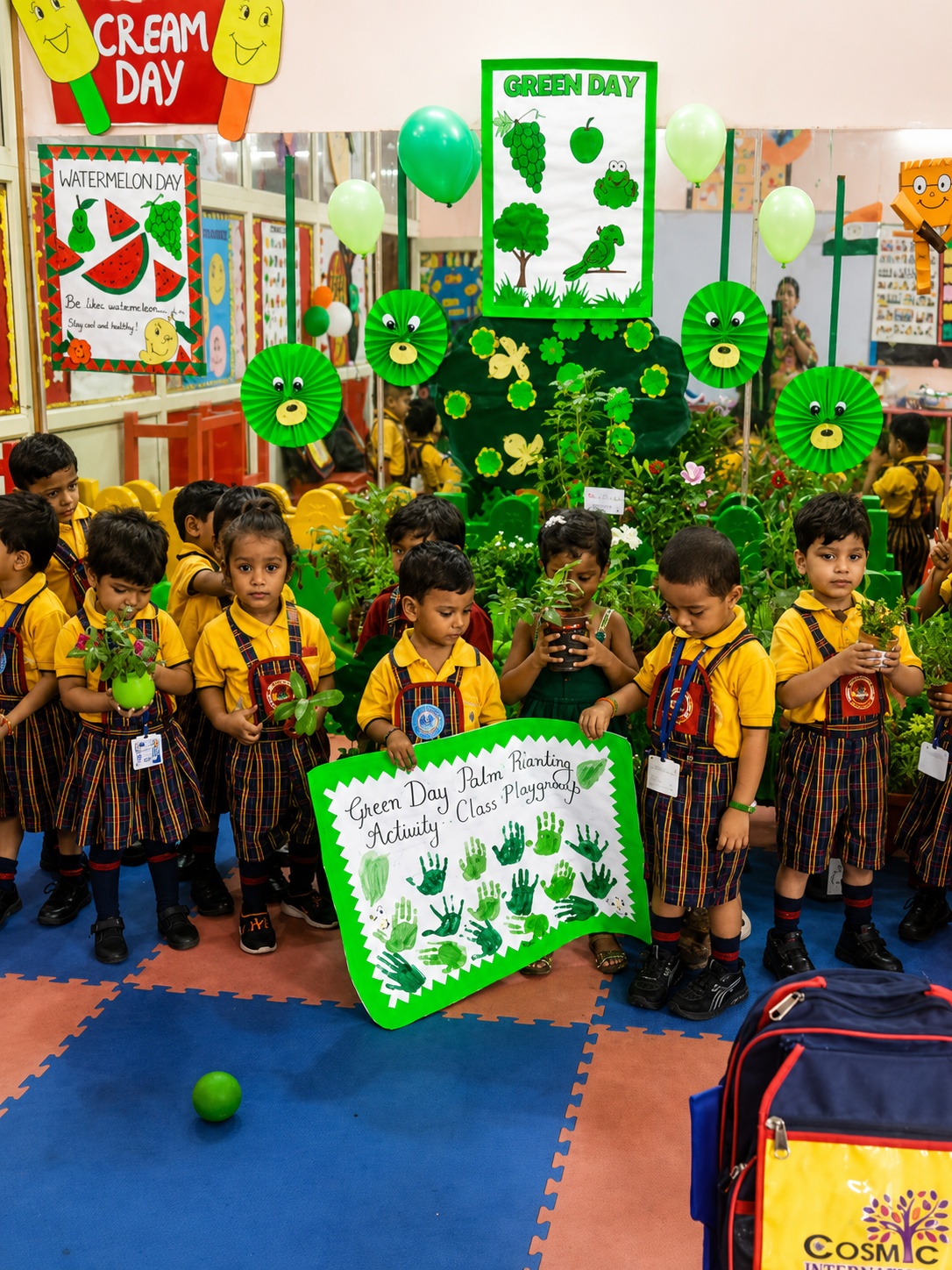 Students holding potted plants during a Green Day plantation activity