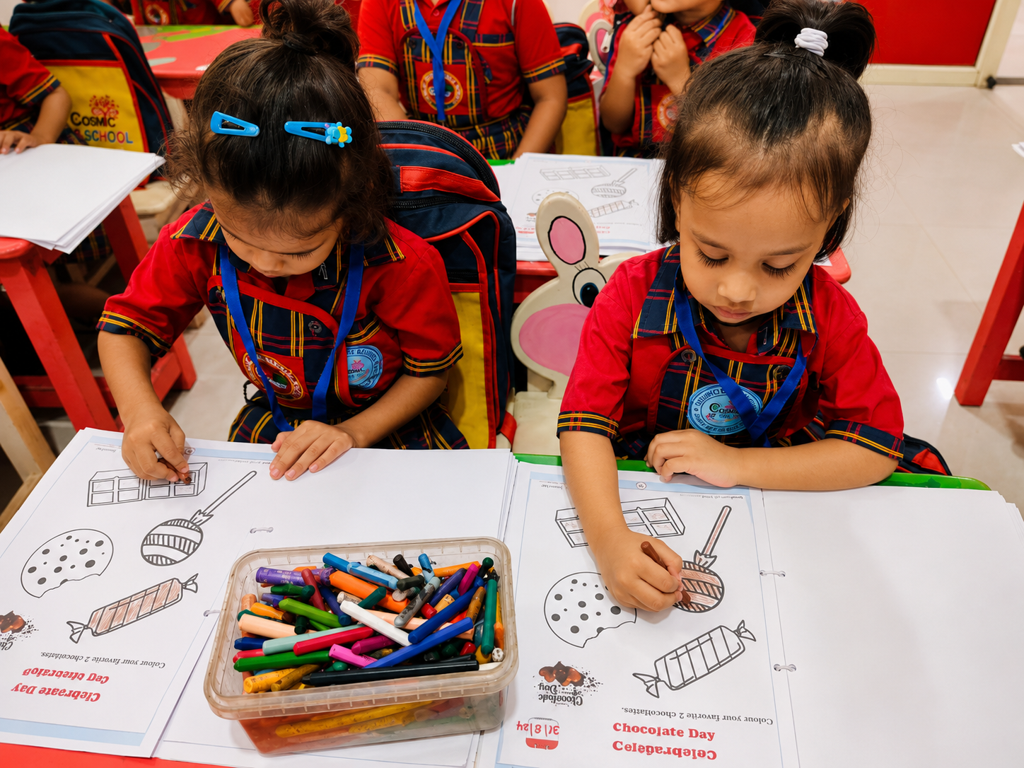 Students taking part in classroom activities, art projects and outdoor play at Cosmic International School